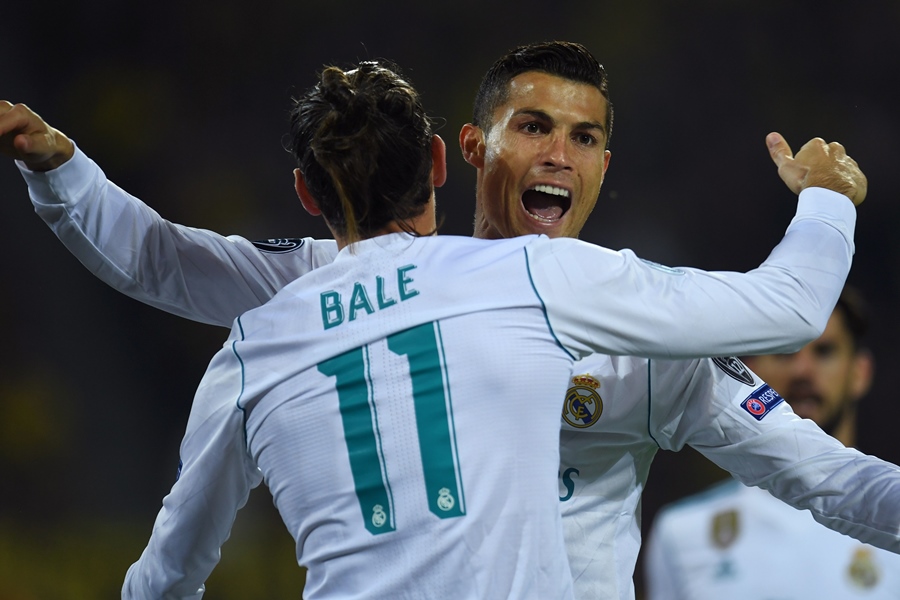 real madrid 039 s forward from portugal cristiano ronaldo r celebrates scoring with his teammate forward from wales gareth bale during the uefa champions league group h football match bvb borussia dortmund v real madrid in dortmund western germany on september 26 2017 photo afp