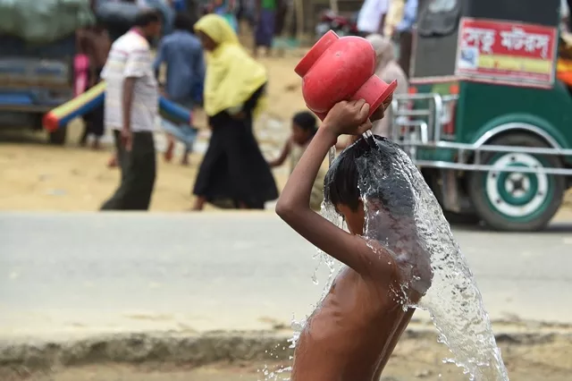 a young rohingya refugee washes himself at the thangkhali refugee camp near ukhia on september 27 2017 photo afp a young rohingya refugee washes himself at the thangkhali refugee camp near ukhia on september 27 2017 photo afp