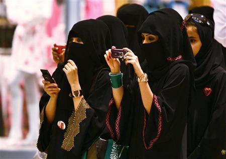 veiled saudi women take photos of their children during a ceremony to celebrate saudi arabia 039 s independence day in riyadh photo reuters