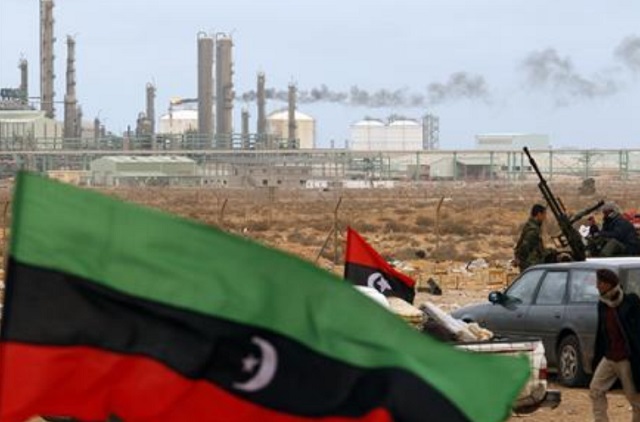 the kingdom of libya flag flies in front of a refinery in ras lanuf in this photo photo reuters