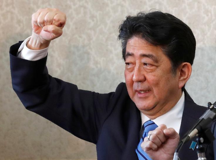 japan 039 s prime minister shinzo abe raises his fist with his party 039 s lawmakers at the party lawmakers 039 meeting after the dissolution of the lower house was announced at the parliament in tokyo japan september 28 2017 photo reuters