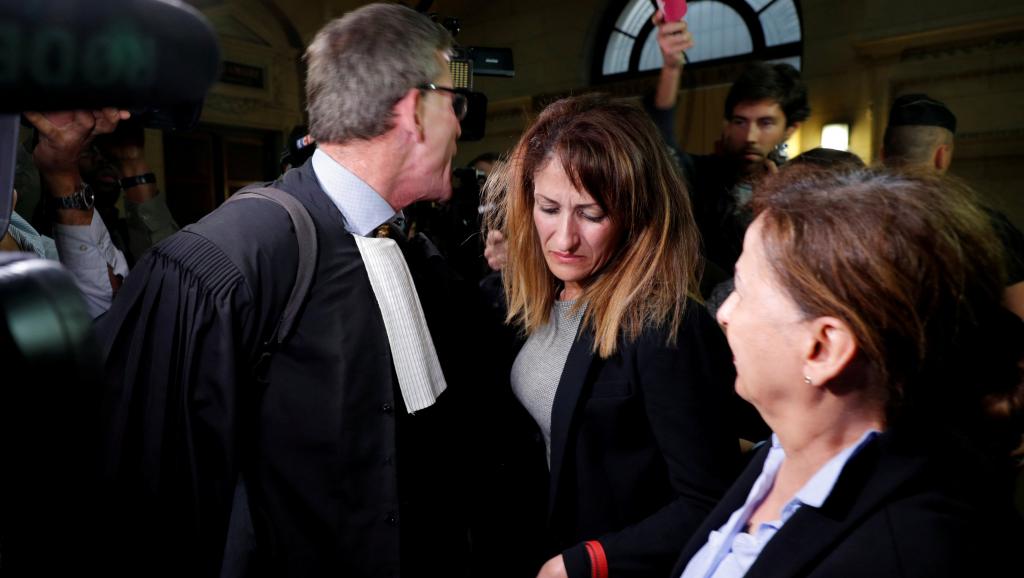 nathalie haddadi centre whose radicalised son fought in syria where he allegedly died as a militant and her lawyer herve denis leave the criminal court after the verdict in the trial where she is accused of aiding and financing terrorism photo reuters