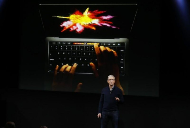 file photo apple ceo tim cook speaks under a graphic of the new macbook pro during an apple media event in cupertino california u s october 27 2016 photo reuters file photo apple ceo tim cook speaks under a graphic of the new macbook pro during an apple media event in cupertino california u s october 27 2016 photo reuters