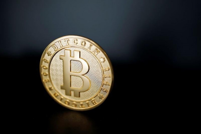 a bitcoin virtual currency coin is seen in an illustration picture taken at la maison du bitcoin in paris france june 23 2017 photo reuters a bitcoin virtual currency coin is seen in an illustration picture taken at la maison du bitcoin in paris france june 23 2017 photo reuters