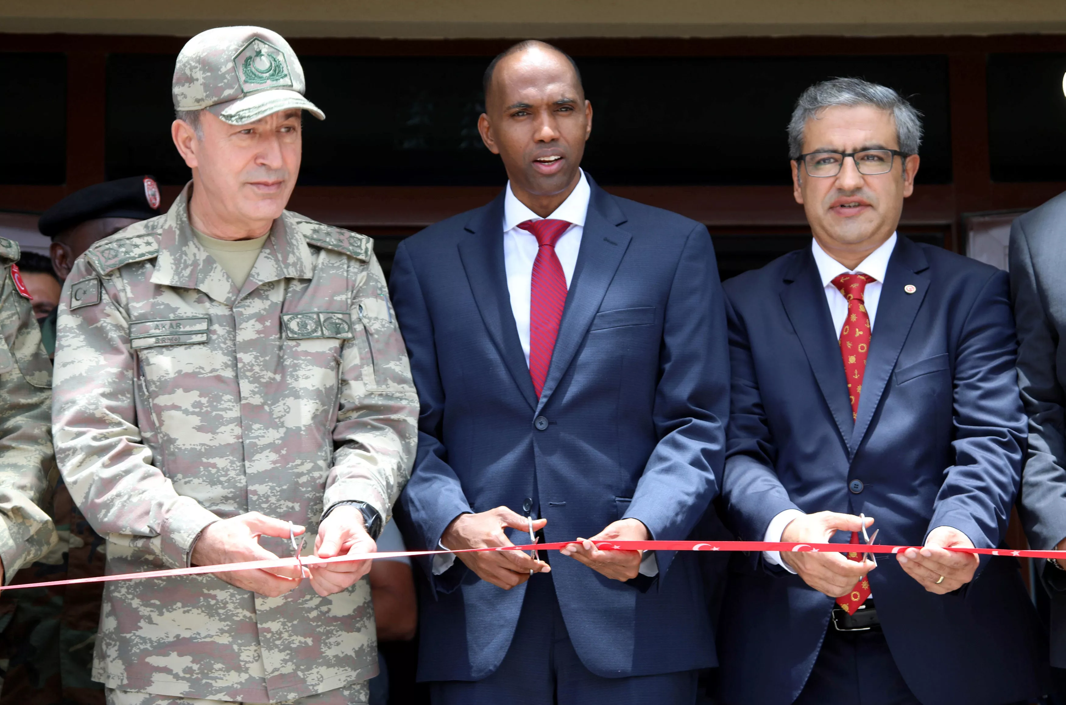 somali prime minister hassan ali khaire c and a turkish military official cut the ribbon at the opening ceremony of the turkish military base in somalia photo reuters somali prime minister hassan ali khaire c and a turkish military official cut the ribbon at the opening ceremony of the turkish military base in somalia photo reuters
