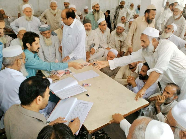 tribal elders receive their stipend at the office of the political agent in ghalanai photo express