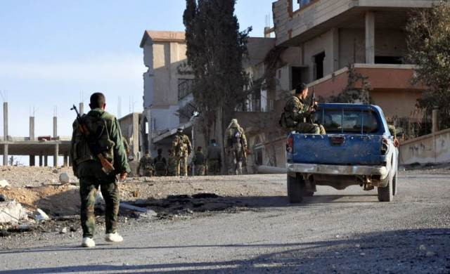 syrian soldiers patrol the town of al quaryatayn in syria 039 s central homs province sunday photo afp syrian soldiers patrol the town of al quaryatayn in syria 039 s central homs province sunday photo afp