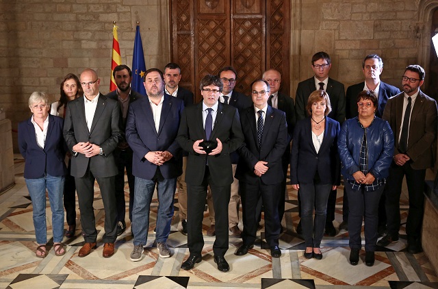 catalan regional president carles puigdemont c is flanked by members of his government as he makes an statement at generalitat palace in barcelona spain october 1 2017 photo reuters