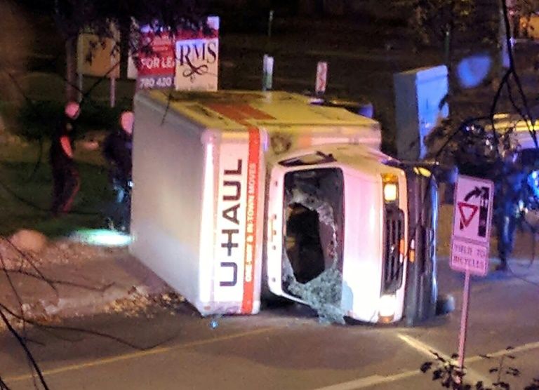 a rental truck lies on its side in edmonton canada after a high speed chase in which the driver is alleged to have deliberately plowed into pedestrians injuring four photo afp