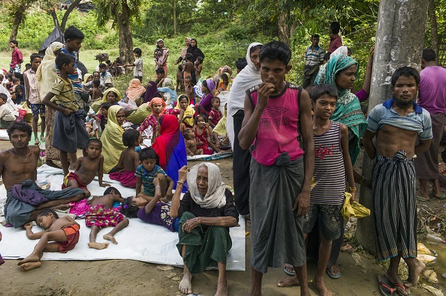 rohingya muslim refugees who had just arrived wait for a place to stay at bangladesh 039 s balukhali refugee camp on october 2 2017 the un says more than 14 100 children are at risk of dying from malnutrition in wretched camps where half a million mainly rohingya refugees depend entirely on charities for survival food distribution in the vastly overcrowded settlements is still ad hoc and uncoordinated the un says more than a month after refugees began pouring into southern bangladesh to escape ethnic bloodshed in myanmar photo afp