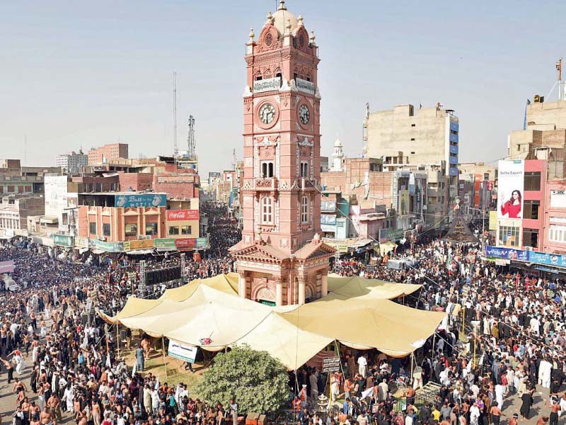 ashura procession passing through clock tower in faisalabad photo online