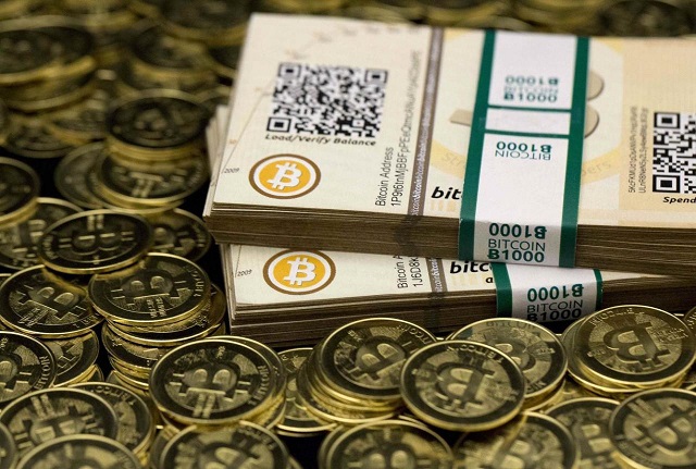 some of bitcoin enthusiast mike caldwell 039 s coins and paper vouchers often called quot paper wallets quot are pictured at his office in this photo illustration in sandy utah january 31 2014 caldwell recommended their use as a way to store bitcoins offline photo reuters