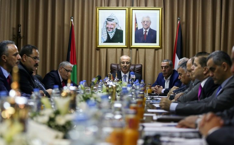 palestinian prime minister rami hamdallah c chairs the first cabinet meeting held in gaza since 2014 as moves intensify to end the decade old rift between the main political factions photo afp