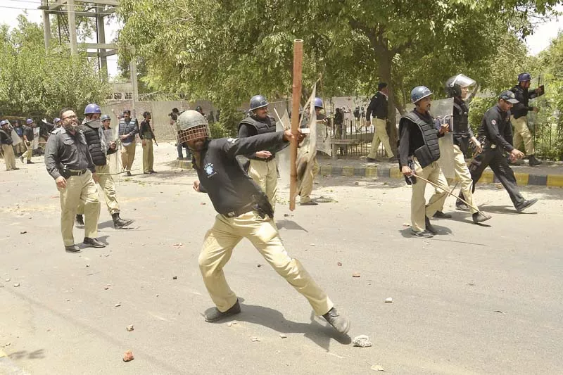 a file photo of policemen responding to qadri supporters in model town photo shafiq malik a file photo of policemen responding to qadri supporters in model town photo shafiq malik