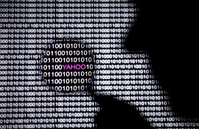 a photo illustration shows a man in front of a yahoo logo seen through a magnifying glass in front of a displayed cyber code photo reuters a photo illustration shows a man in front of a yahoo logo seen through a magnifying glass in front of a displayed cyber code photo reuters