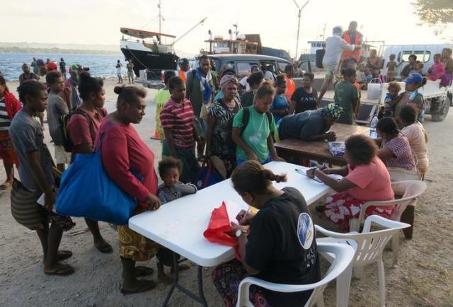 residents evacuated due to the the manaro voui volcano located on vanuatu 039 s northern island ambae register with authorities after disembarking from a boat at luganville port on vanuatu 039 s espiritu santos island located in the south pacific october 3 2017 photo reuters