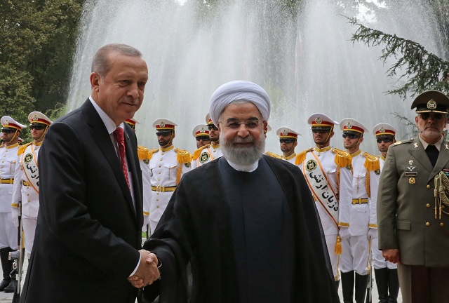 a handout picture provided by the iranian presidency shows iran 039 s president hassan rouhani r shaking hands with turkish president recep tayyip erdogan during a welcome ceremony in tehran on october 4 2017 erdogan is visiting iran in a sign of warming ties between the two neighbours which support rival camps in syria but both strongly oppose last week 039 s iraqi kurdish vote for independence photo afp