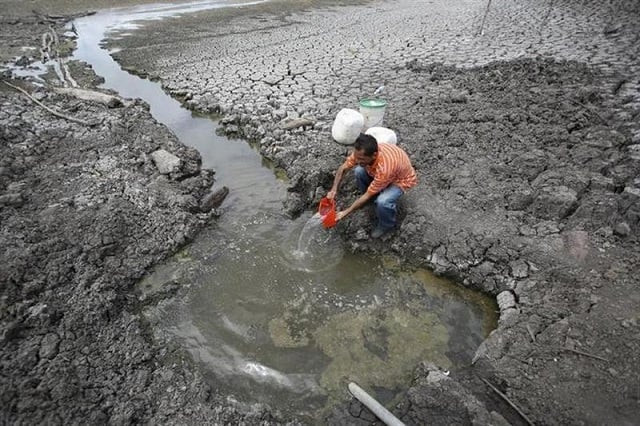 a resident fills a container with water taken from a partially dried up reservoir in the las canoas lake some 59 km 37 miles north of the capital managua april 8 2010 photo reuters oswaldo rivas files a resident fills a container with water taken from a partially dried up reservoir in the las canoas lake some 59 km 37 miles north of the capital managua april 8 2010 photo reuters oswaldo rivas files