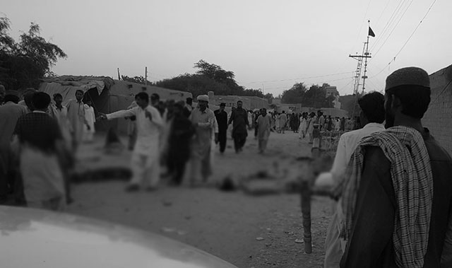 devotees gather around the bodies of blast victims after a suicide bombing near a sufi shrine in the gandawa area of jhal magsi district of balochistan on october 5 2017 photo afp