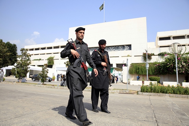 frontier constabulary fc personnel walk past the parliament building photo reuters