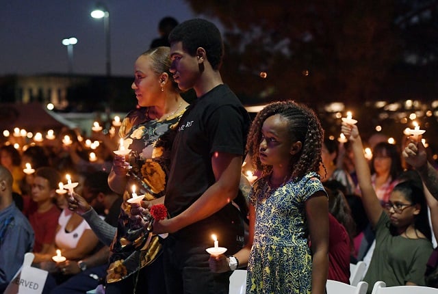 veronica hartfield widow of slain las vegas metropolitan police department officer charleston hartfield and their son ayzayah hartfield 15 and daughter savannah hartfield 9 attend a vigil for charleston hartfield at police memorial park on october 5 2017 in las vegas nevada charleston hartfield who was off duty at the route 91 harvest country music festival on october 1 was killed when stephen paddock opened fire on the crowd killing at least 58 people and injuring more than 450 the massacre is one of the deadliest mass shooting events in us history photo afp