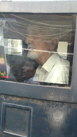 father of missing person samar abbas sitting inside the police van after surrendering his arrest father of missing person samar abbas sitting inside the police van after surrendering his arrest