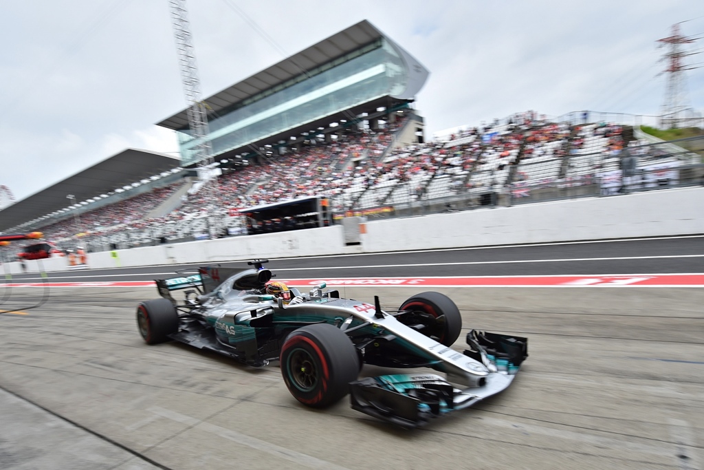 nearly there a three time winner of the japanese grand prix hamilton fired a clear warning to vettel who realistically needs to win this weekend to revive his fading title hopes photo afp