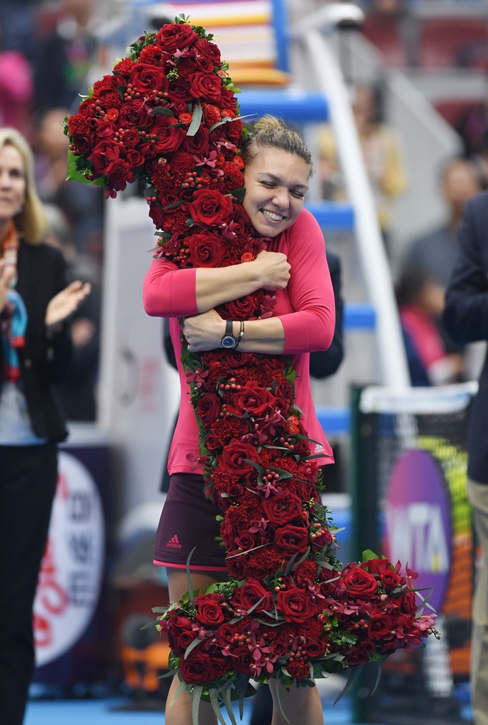 country s pride simona halep takes over the top spot from spaniard garbine muguruza and will become the first romanian to head the rankings when the updated standings are released on monday photo afp
