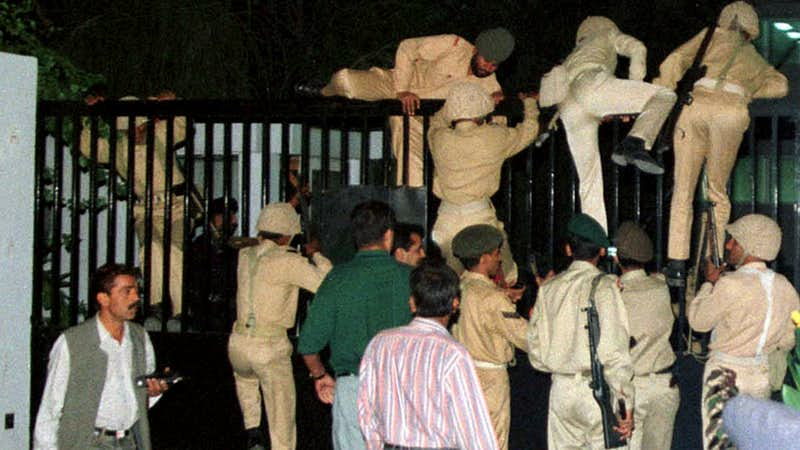 army men climb over the main gate of ptv hq in islamabad during the military coup of 1999 photo reuters