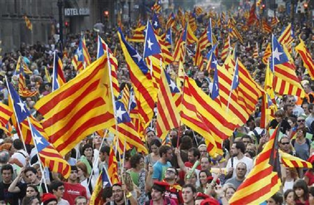 marchers wave catalonian nationalist flags as they demonstrate during catalan national day in barcelona photo reuters