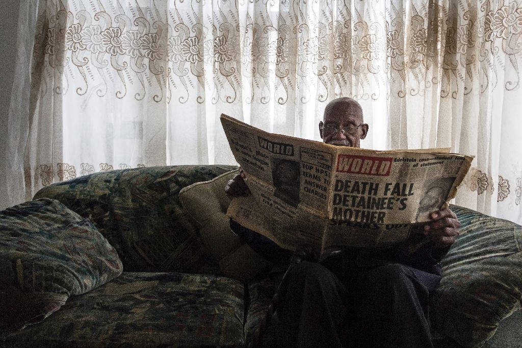 phillip mabelane paging through a newspaper from the period has been battling for 40 years for an investigation into the truth behind his son 039 s 1977 death under apartheid photo afp