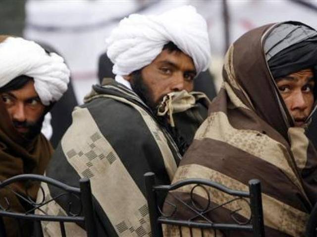 afghan taliban look on after handing over their weapons as they join the afghan government 039 s reconciliation and reintegration program in herat province february 17 2013 photo reuters