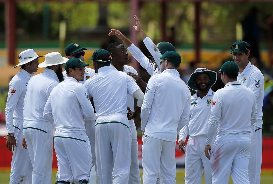 south africa 039 s bowler kagiso rabada c is congratulated by teammates after taking his 100th test match wicket during the third day of the second test cricket match between south africa and bangladesh in bloemfontein on october 8 2017 photo afp