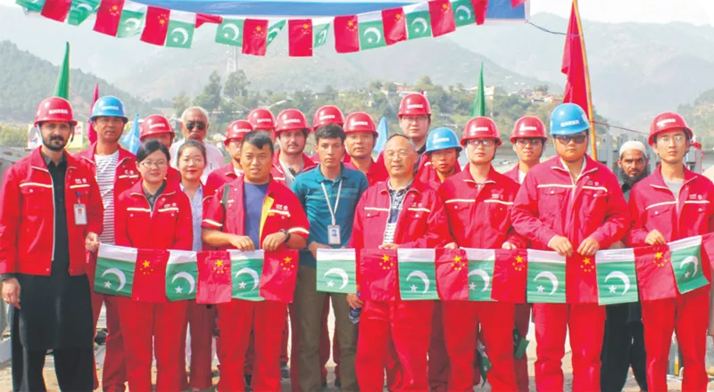 chinese engineers who repaired the ayub bridge in balakot pose for a group photo holding miniature pakistani flags photo express chinese engineers who repaired the ayub bridge in balakot pose for a group photo holding miniature pakistani flags photo express