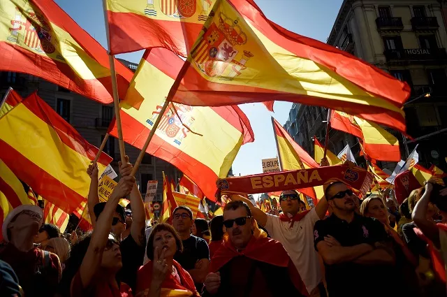 people wave spanish flags during a demonstration called by quot societat civil catalana quot catalan civil society to support the unity of spain on october 8 2017 in barcelona spain braced for more protests despite tentative signs that the sides may be seeking to defuse the crisis after madrid offered a first apology to catalans injured by police during their outlawed independence vote photo afp people wave spanish flags during a demonstration called by quot societat civil catalana quot catalan civil society to support the unity of spain on october 8 2017 in barcelona spain braced for more protests despite tentative signs that the sides may be seeking to defuse the crisis after madrid offered a first apology to catalans injured by police during their outlawed independence vote photo afp