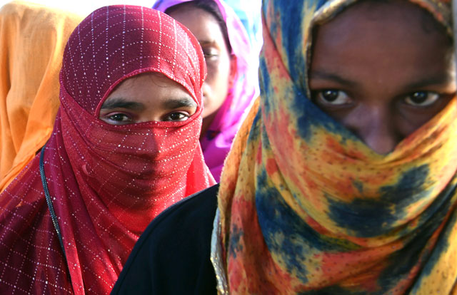 rohingya refugees wait for a health check up at the thangkhali refugee camp in ukhia district on october 8 2017 photo afp