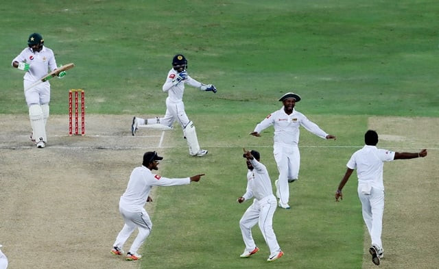 sri lankan players celebrate the dismissal of azhar ali photo afp sri lankan players celebrate the dismissal of azhar ali photo afp