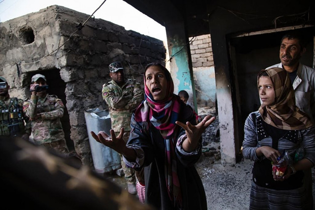 one of arkady 039 s powerful images this one taken last november shows a woman talking to an erd intelligence officer after her house was bombed by iraqi air strikes and her brother kidnapped by isis in qabr al abd village near mosul photo afp one of arkady 039 s powerful images this one taken last november shows a woman talking to an erd intelligence officer after her house was bombed by iraqi air strikes and her brother kidnapped by isis in qabr al abd village near mosul photo afp