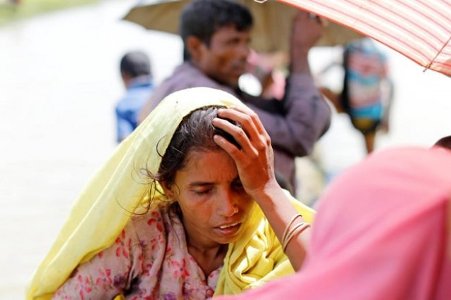 rohingya refugees wait on a rice field after crossing the border in palang khali bangladesh october 9 2017 photo reuters rohingya refugees wait on a rice field after crossing the border in palang khali bangladesh october 9 2017 photo reuters