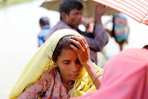 rohingya refugees wait on a rice field after crossing the border in palang khali bangladesh october 9 2017 photo reuters