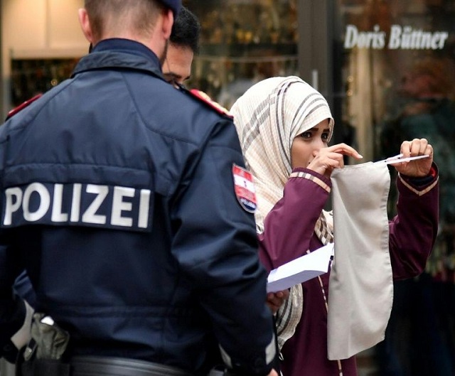 police officers ask a woman to unveil her face in zell am see in austria photo yahoo news