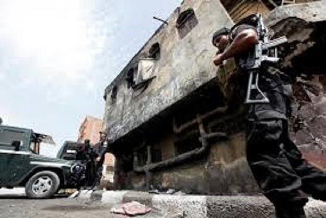 police officers stand in front of a police station damaged after being set ablaze in august by supporters of former president mohamed mursi in kerdasa 9 miles from cairo september 19 2013 photo reuters