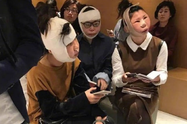 the women wrapped chin to dome in bandages were barred from boarding a flight home at an airport in south korea detained and grilled by immigration officers photo courtesy asia wire the women wrapped chin to dome in bandages were barred from boarding a flight home at an airport in south korea detained and grilled by immigration officers photo courtesy asia wire