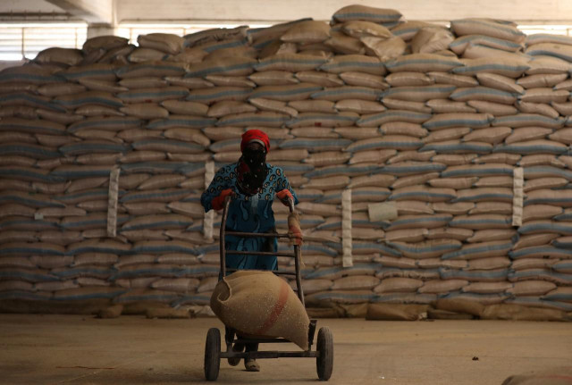 a woman pushes a cart loaded with a sack of wheat in qamishli syria september 18 2017 photo reuters a woman pushes a cart loaded with a sack of wheat in qamishli syria september 18 2017 photo reuters
