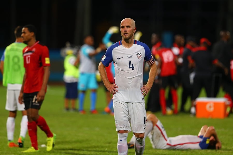 a contrast of emotions as captain michael bradley c of the united states national team reacts as trinidad and tobago pull of a win during the fifa world cup qualifier match between trinidad and tobago at the ato boldon stadium on october 10 2017 in couva trinidad and tobago photo afp