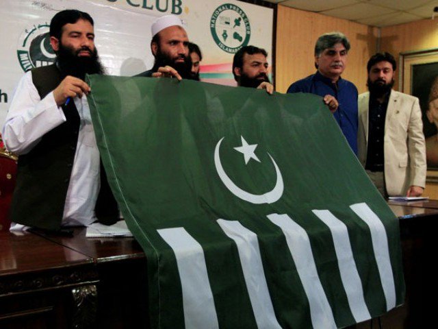 saifullah khalid 2nd l president of milli muslim league mml political party holds a party flag with others during a news conference in islamabad on august 7 2017 photo reuters