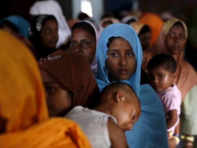 rohingya migrants who arrived in indonesia last week by boat wait in line to receive donations at a temporary shelter in aceh timur regency near langsa in indonesia 039 s aceh province may 25 2015 photo reuters