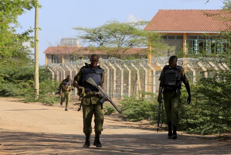 kenya defense force soldiers walk near the perimeter wall where attackers are holding up at a campus in garissa april photo reuters