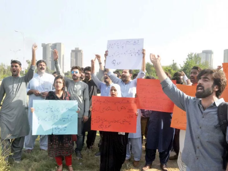 qau students protest against the university s administration photo express qau students protest against the university s administration photo express