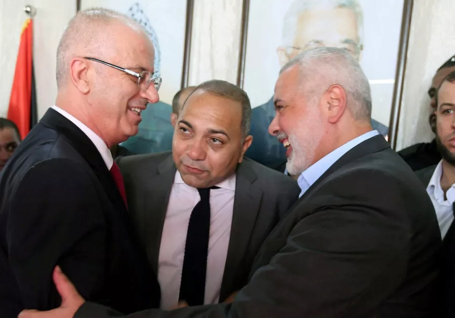prime minister rami hamdallah left shakes hands with hamas chief ismail haniyeh in gaza city on october 2 photo reuters prime minister rami hamdallah left shakes hands with hamas chief ismail haniyeh in gaza city on october 2 photo reuters